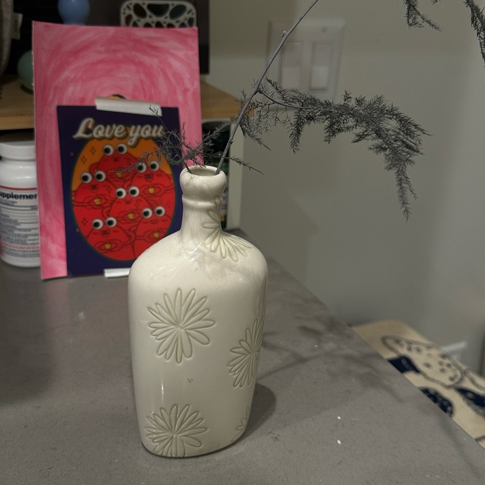 cream vase with flowers